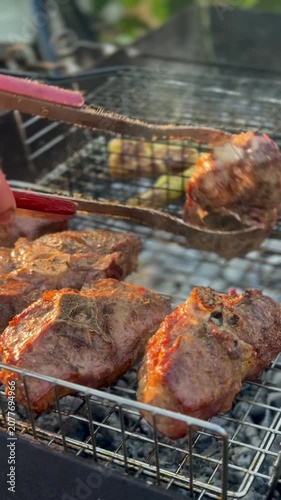 Grilling Marinated Lamb and Fresh Vegetables on Outdoor Barbecue