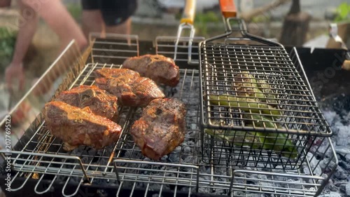 Grilling Marinated Lamb and Fresh Vegetables on Outdoor Barbecue