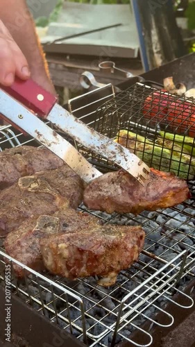 Grilling Marinated Lamb and Fresh Vegetables on Outdoor Barbecue