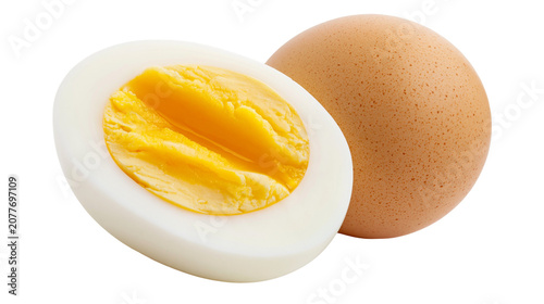 Vászonkép Whole brown egg and half hard-boiled egg with yellow yolk