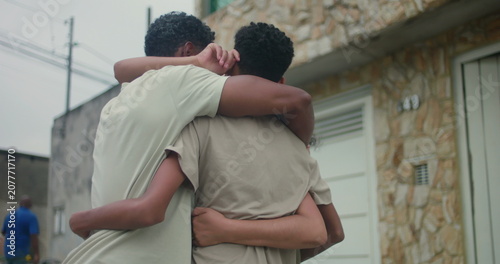 фотографія Close-up of a family of African descent in a heartfelt group hug, highlighting u
