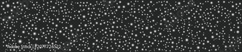 A stunning nighttime scene of numerous white dots scattered across a vast black sky filled with stars, showcasing a mesmerizing display of celestial activity.