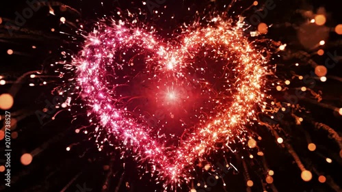 Glowing sparkler heart animation, romantic red and pink light trails, abstract love background, for valentine’s day, and wedding celebration projects