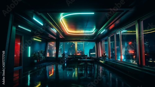 Modern office hallway with colorful neon lighting at night