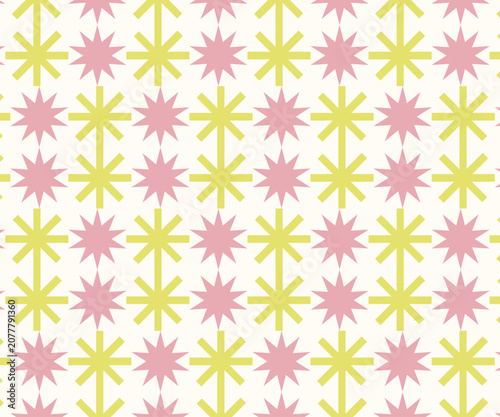 A playful and bright seamless pattern featuring alternating pink and yellow star-like floral motifs on a light cream background. Perfect for children's designs gift wrapping and stationery.