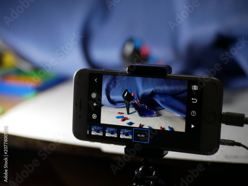 Photography Behind the scenes of stop motion animation process on a smartphone tripod setup