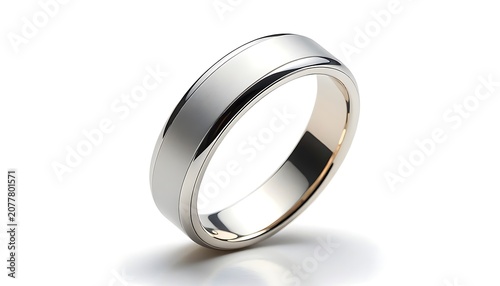 A shiny silver ring is standing on its side on a surface.