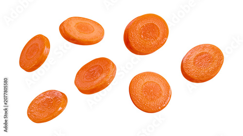 Foto Orange carrot slices round cut, fresh vegetable pieces