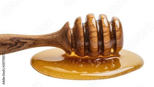 Fotografía Wooden honey dipper with dripping golden honey