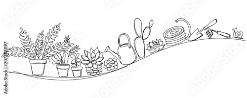 Gardening Tools And Plants Arranged On Window Sill.