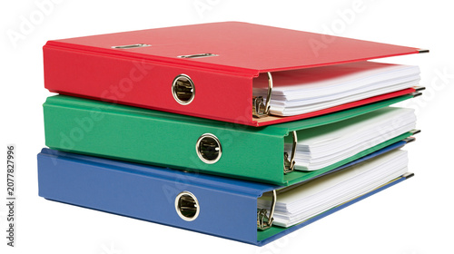 Quadro su tela Stack of red green, and blue ring binders with paper