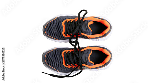 Obraz na plátne Dark grey and orange mesh athletic shoes with black laces
