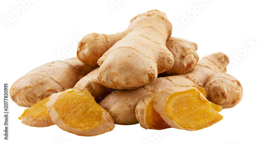 Tableau sur toile Heap of fresh ginger roots, some cut showing yellow flesh