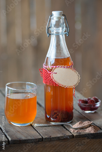 Fermented natural organic Kombucha with cocoa and cherry - healthy sparkling drink