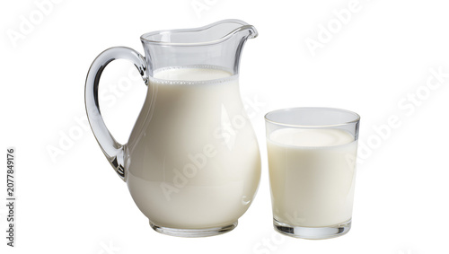 Fotografie Clear glass pitcher and drinking glass filled with fresh white milk, isolated on