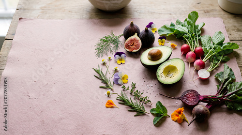 Organic Grocery Flat Lays Avocado, Radish and Herbs on Soft Pink Background