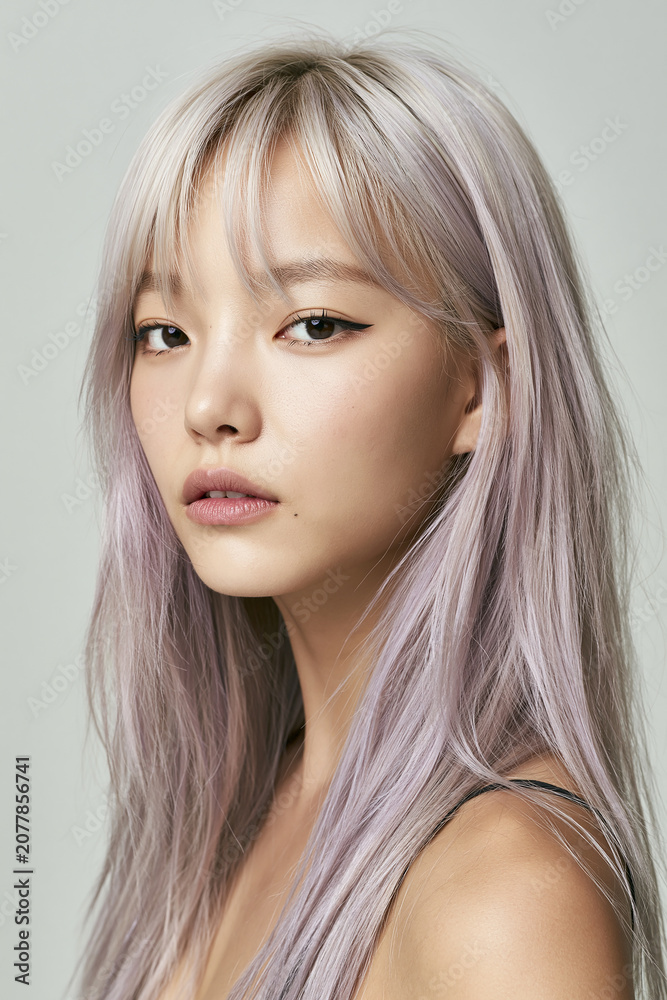 Naklejka premium Korean Young Woman With Long Straight Bleached Silver Hair With Purple Tint And Bangs Portrait