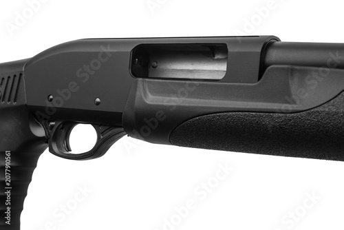 Valokuva Close-up of a black tactical shotgun receiver with an open ejection port on a wh