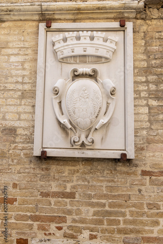 Relief on facade of historic aerospace museum, housed in Palazzo Comunale (Town Hall), Loreto, Italy