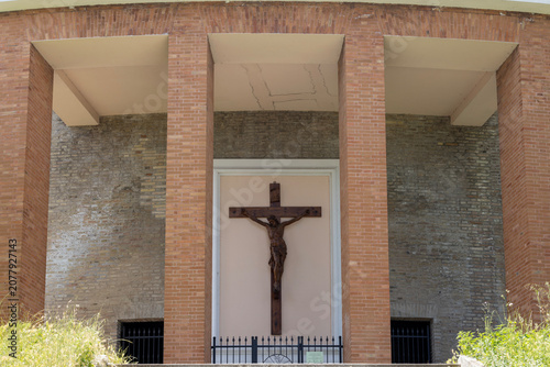 Christian wooden cross (crucifix) at Scala Santa, pilgrimage path leading to Basilica of the Holy House, Loreto, Italy