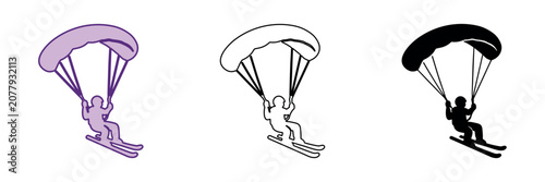 Photos Person skiing with a parachute gliding through the air