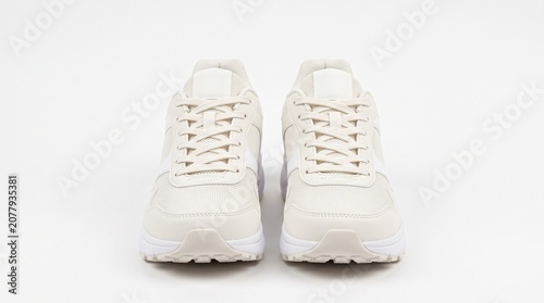 Pair of offwhite athletic sneakers isolated on white background