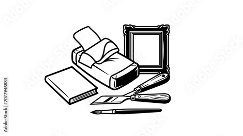 Art supplies including paintbrushes palette knife and frame.