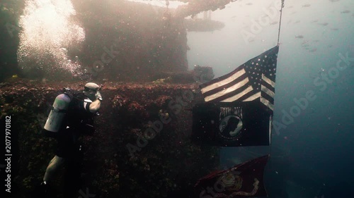 Marine Scuba Diver Saluting American Flag on Sunken USS Oriskany Shipwreck