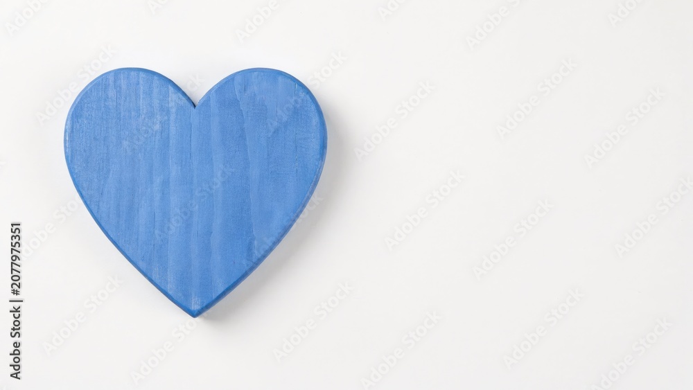 Obraz premium Blue wooden heart shape isolated on a plain white background