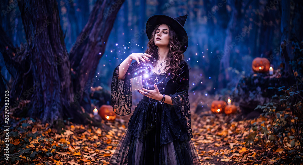 Fototapeta premium Mystical Witch Casting Magic Spell in Enchanted Halloween Forest Night