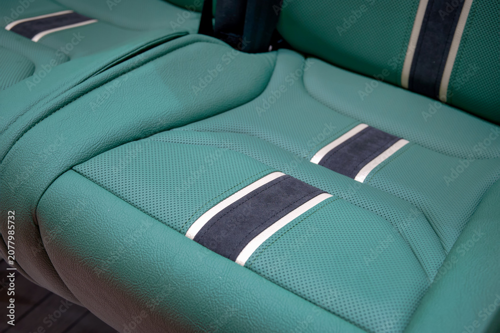 Fototapeta premium A comfortable seat for city bus passengers made of perforated eco-leather. Modern materials ensure a comfortable ride.