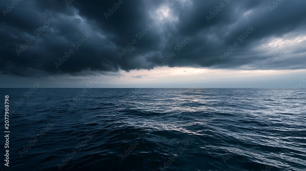 Fototapeta premium Calm ocean waves meet swirling storm clouds creating a tranquil and inviting atmospheric seascape
