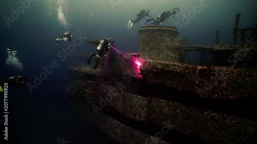 Wide View of Scuba Divers Exploring the Sunken USS Oriskany Aircraft Carrier