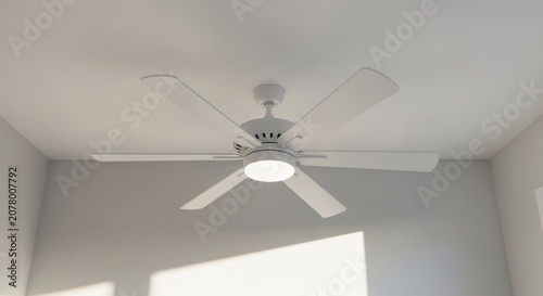 Modern White Ceiling Fan with Integrated Light Fixture.