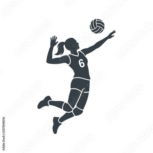 Female volleyball player jumping to spike the ball.