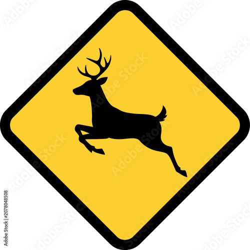 A deer crossing sign shows a running deer on yellow road sign