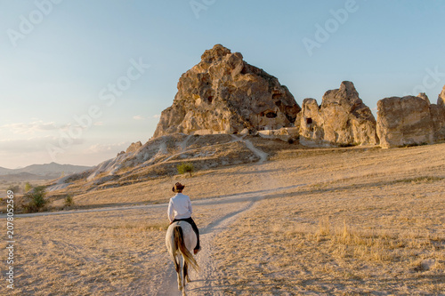 Horse riding in the landscpae of Cappadocia, known as the land of Beautiful horses, Anatolia, Turkey.