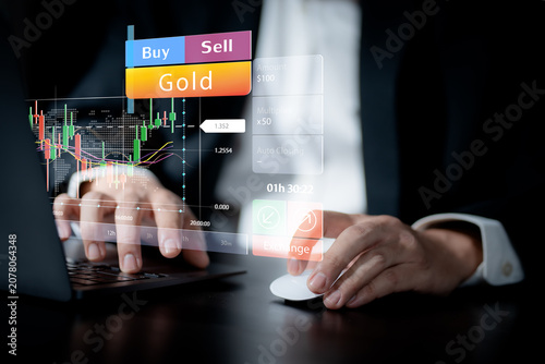Gold trading and online investment concept. Business professional analyzing live market charts and executing buy and sell orders on a digital trading platform. gold, trading, investment, forex, market