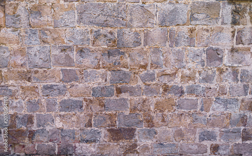 Ancient natural stone wall texture background old weathered surface