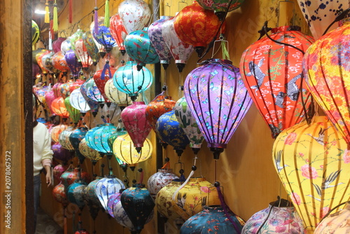 Wide collection of decorative silk lanterns featuring diverse colorful hand designs.