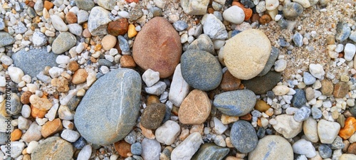 Canvas Print Macro background of small smooth river pebbles