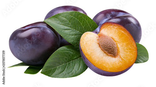 Photography Ripe purple plums with green leaves one halved revealing juicy orange flesh and