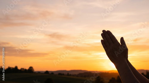 Silhouette of Human Hands Praying at Sunset Concept of Faith and Hope