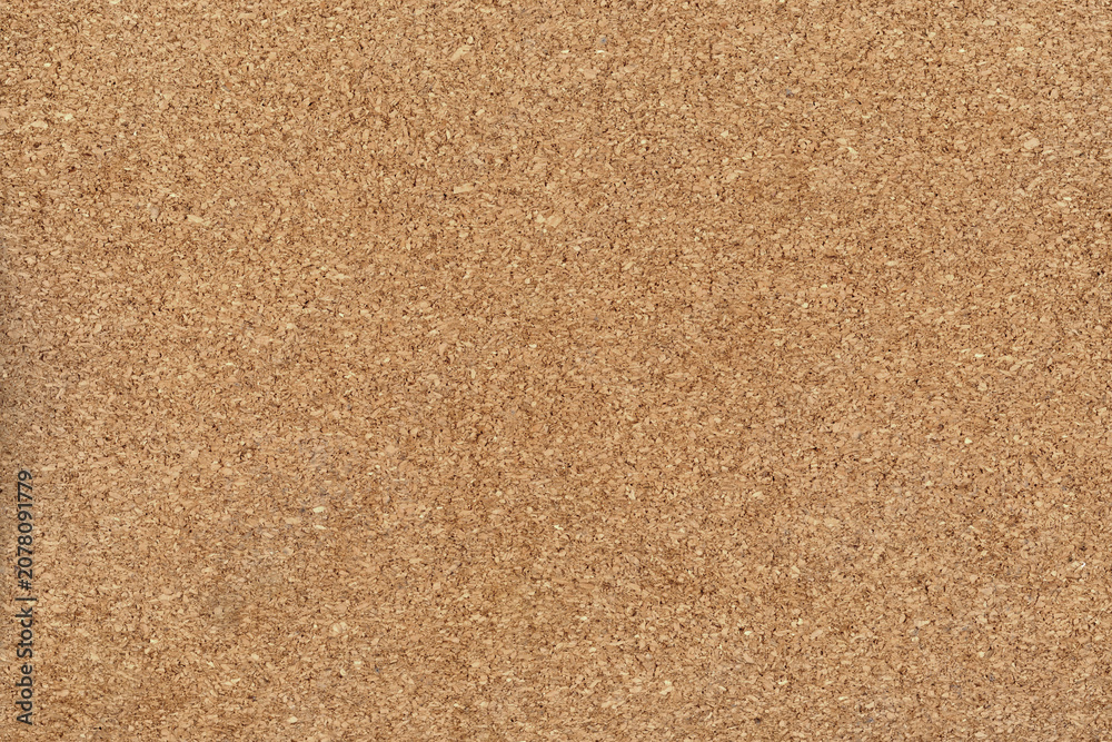 Fototapeta premium Natural cork texture background in light brown, with a rough, organic surface
