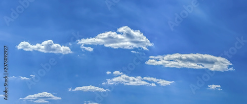 Obraz na płótnie A relaxed clouds decomposing in the wind, spreads into a pancake shape