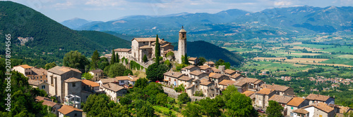 Greccio Rieti Italy High Resolution. 16k 3:1 drone panorama of narrow hilltop medieval borgo on 70mm lens with background valley and mountains. Borghi piu belli d Italia most beautiful villages