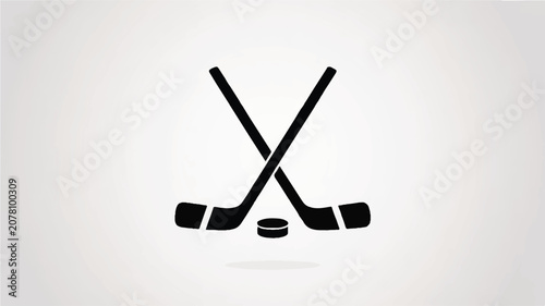 Two crossed hockey sticks with puck on white background