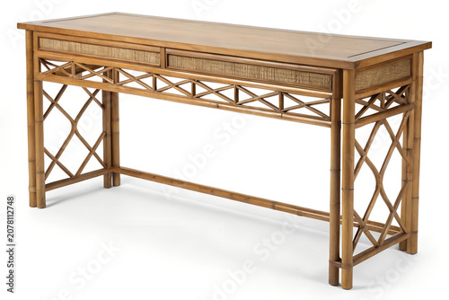 Rattan console table with woven details photographed on a white background