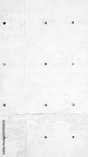 Minimalist white concrete wall with a smooth texture mobile wallpaper and visible bolt details