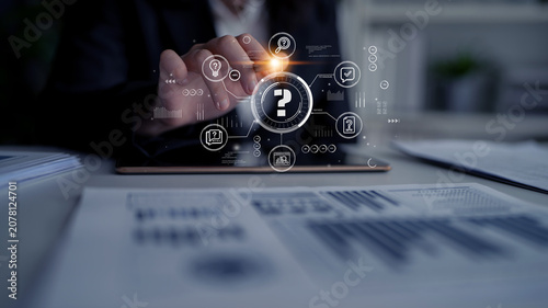 Foto Business professional using tablet with digital icons and data graphics on desk, focusing on technology and innovation in a modern workspace